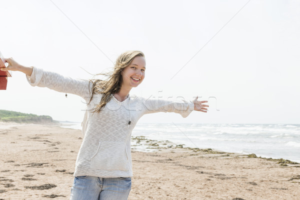 Young woman happy on beach Stock photo © elenaphoto