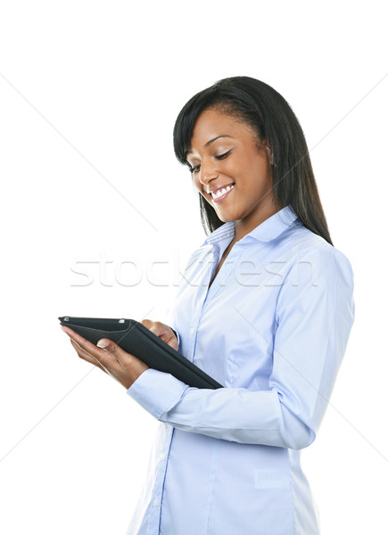 Happy woman with tablet computer Stock photo © elenaphoto