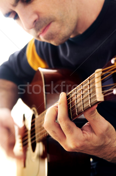 Man playing a guitar Stock photo © elenaphoto
