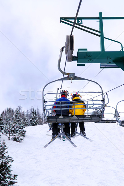Skiers on chairlift Stock photo © elenaphoto