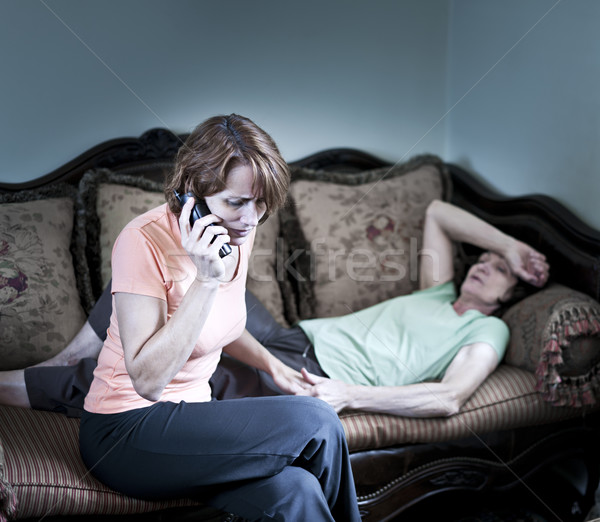 Concerned woman with sick mother Stock photo © elenaphoto