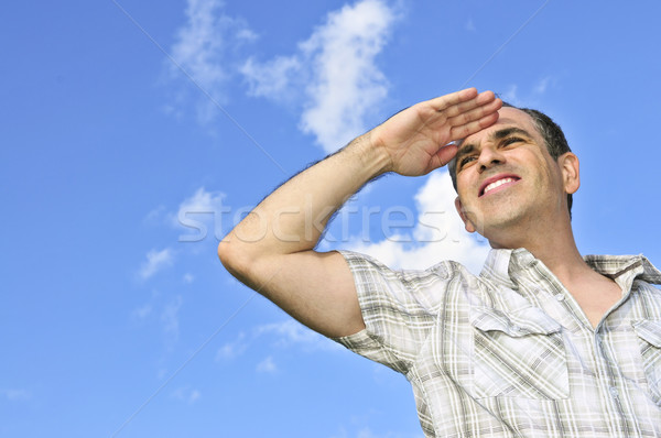 Stock photo: Happy man looking into distance