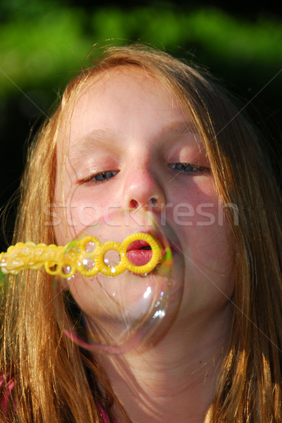 Young girl soap bubbles Stock photo © elenaphoto