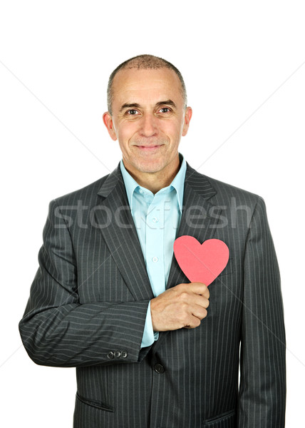 Man with paper heart on white background Stock photo © elenaphoto