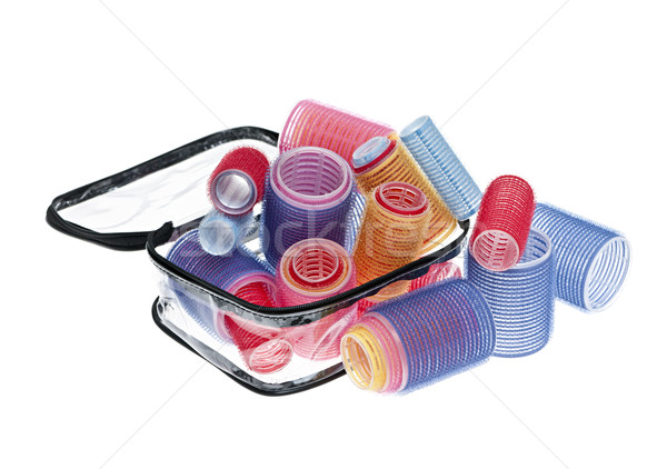 Case of hair rollers on white Stock photo © elenaphoto