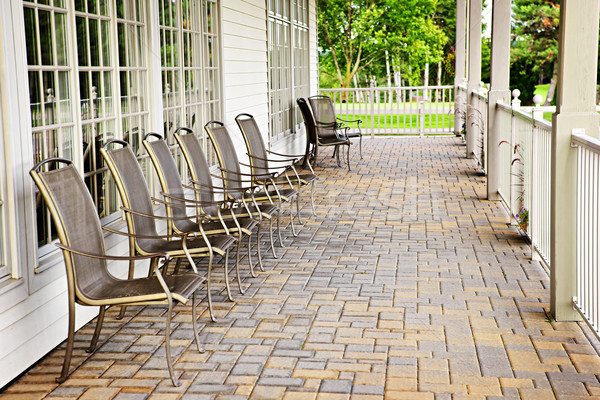 Krzesła patio rząd metal cegły Windows Zdjęcia stock © elenaphoto