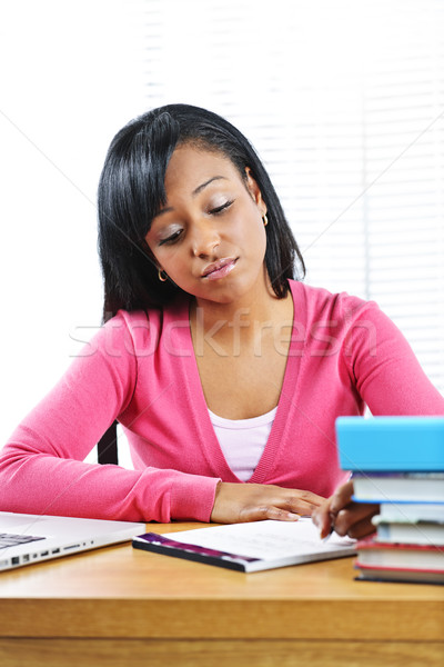 Stock photo: Unhappy female student studying