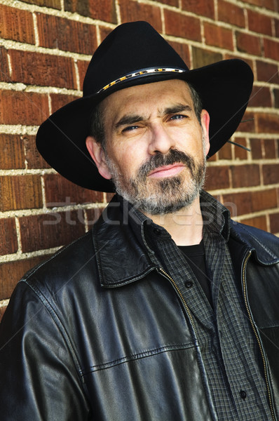 Barbuto uomo cappello da cowboy barba muro Foto d'archivio © elenaphoto