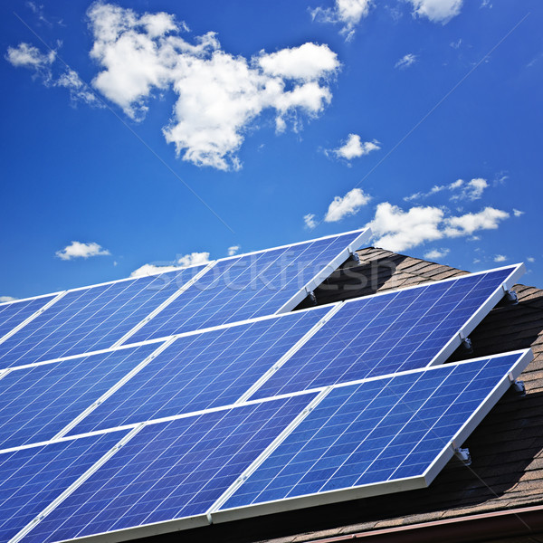 Napelemek tömb alternatív energia fotovoltaikus tető Stock fotó © elenaphoto