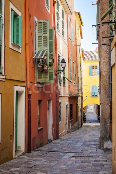 Bright houses on old street in Villefranche-sur-Mer Stock photo © elenaphoto