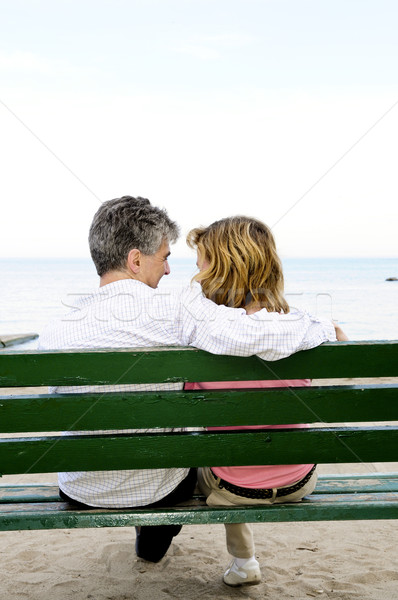 Mature romantic couple on a bench Stock photo © elenaphoto