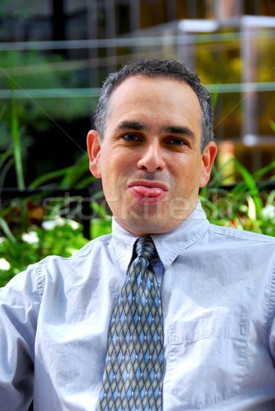 Businessman silly face Stock photo © elenaphoto