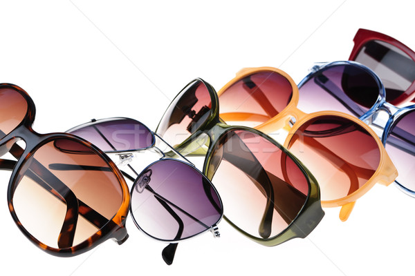 Güneş gözlüğü farklı stilleri beyaz cam arka plan Stok fotoğraf © elenaphoto