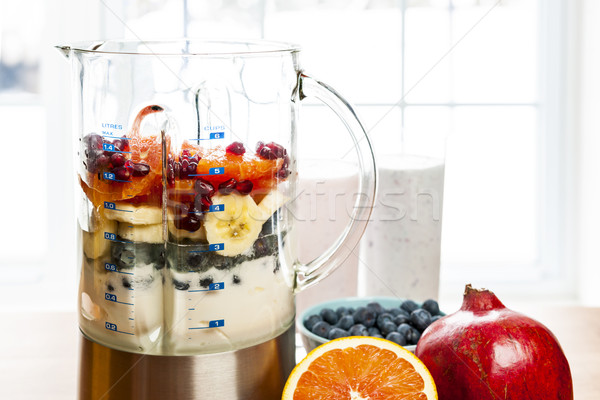 Making smoothies in blender with fruit and yogurt Stock photo © elenaphoto