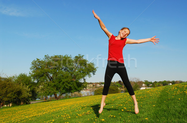 Young girl jumping Stock photo © elenaphoto
