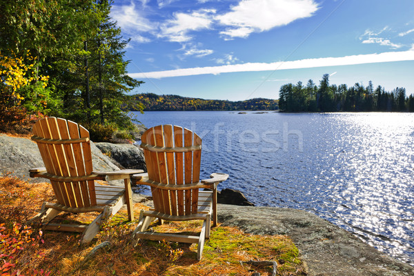 Stock photo: Adirondack chairs at lake shore