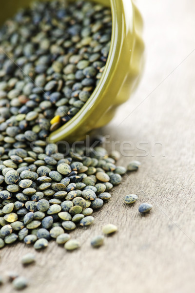 Bowl of uncooked French lentils Stock photo © elenaphoto