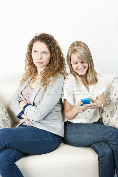 Stock photo: Woman breaching cell phone etiquette