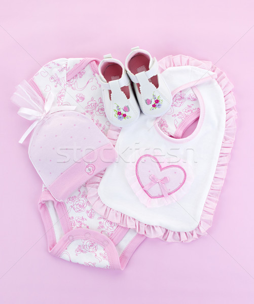 Stock photo: Pink baby clothes for infant girl