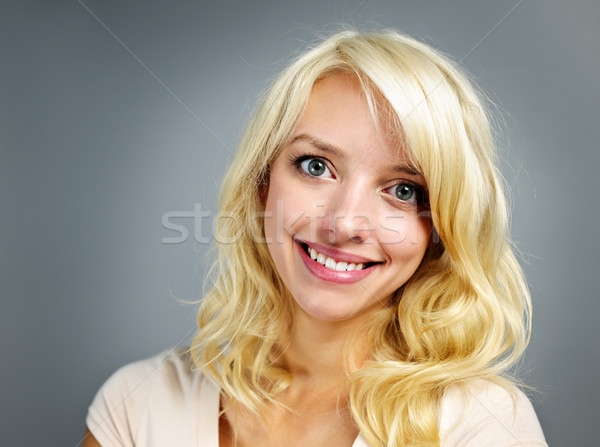 Young smiling woman portrait Stock photo © elenaphoto