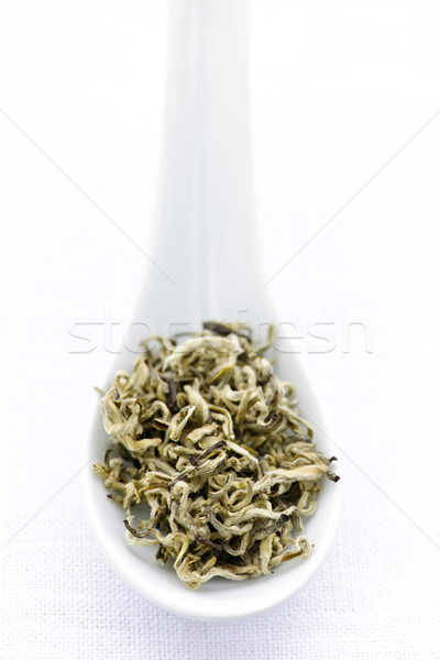 Dry white tea leaves in a spoon Stock photo © elenaphoto