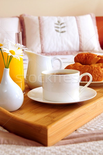 Breakfast on a bed in a hotel room Stock photo © elenaphoto
