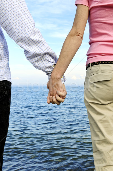 Couple holding hands Stock photo © elenaphoto