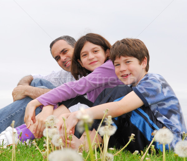 Mutlu aile portre üç yeşil ot aile kız Stok fotoğraf © elenaphoto