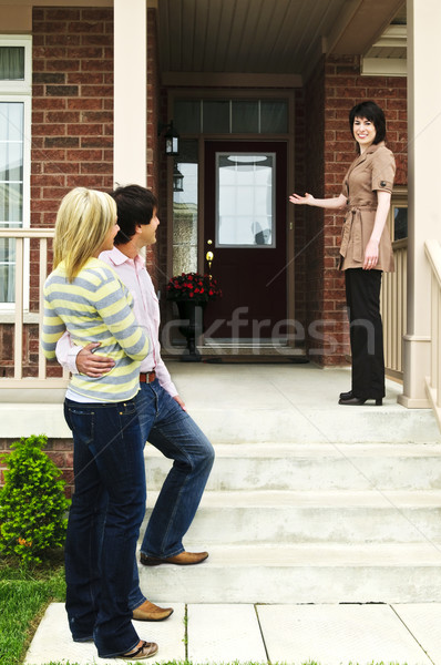 Stock photo: Happy couple with real estate agent