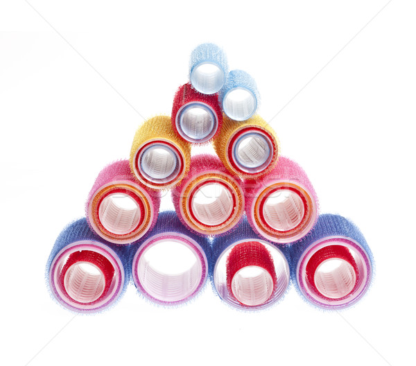 Hair rollers on white Stock photo © elenaphoto