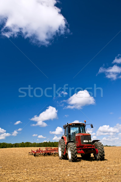 Tractor in plowed field Stock photo © elenaphoto
