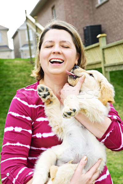 Woman holding puppy Stock photo © elenaphoto