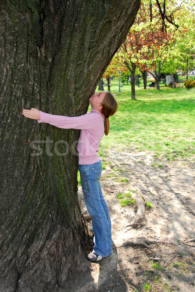 Girl and big tree Stock photo © elenaphoto