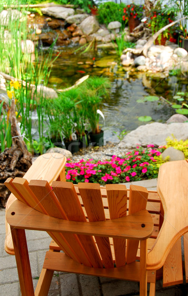 Teich natürlichen Stein Holz Terrasse Stuhl Stock foto © elenaphoto