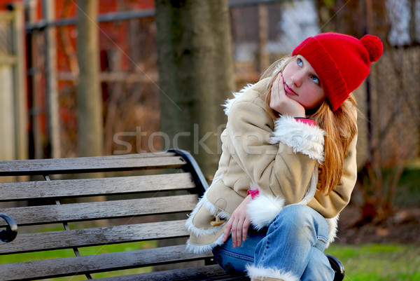 Dziewczyna ławce portret młoda dziewczyna posiedzenia na zewnątrz Zdjęcia stock © elenaphoto