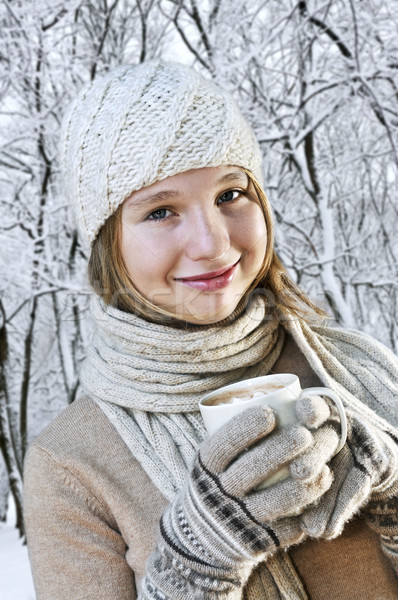 Hiver fille adolescente chapeau tasse chocolat chaud [[stock_photo]] © elenaphoto