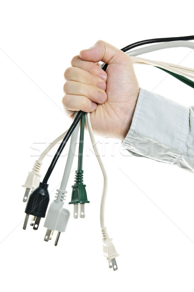 Hand holding bundle of power cables Stock photo © elenaphoto