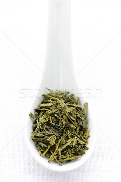 Dry green tea leaves in a spoon Stock photo © elenaphoto