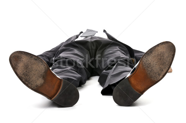 Stock photo: Businessman laying down on white background