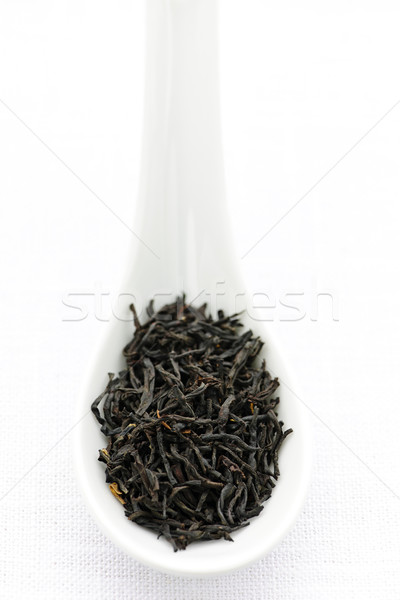 Dry black tea leaves in a spoon Stock photo © elenaphoto