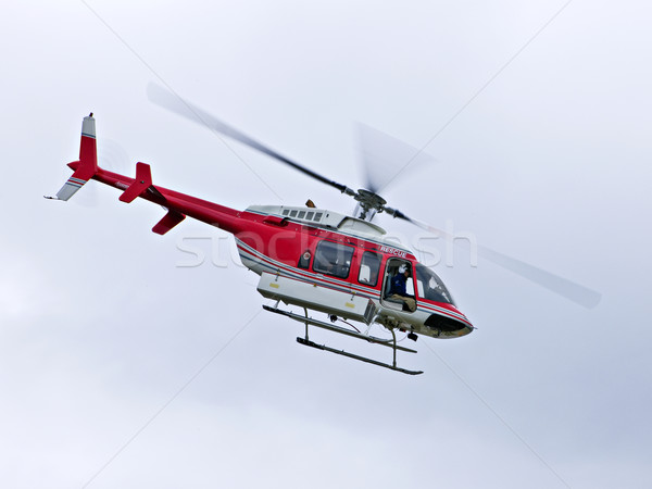 Resgatar helicóptero vermelho voador missão emergência Foto stock © elenaphoto