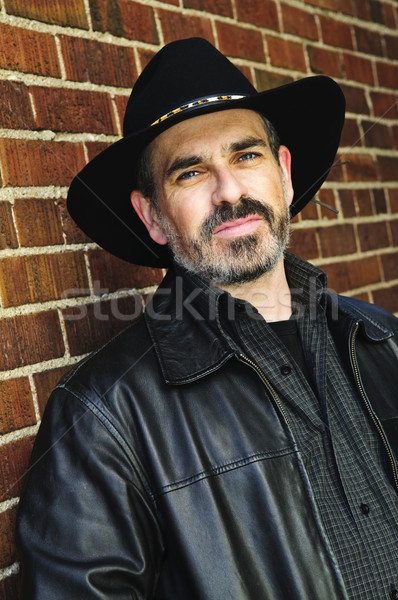 Barbuto uomo cappello da cowboy barba muro Foto d'archivio © elenaphoto