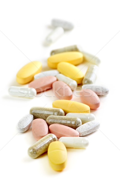 Keverék vitaminok szárított növénygyűjtemény kiegészítők fehér étel Stock fotó © elenaphoto