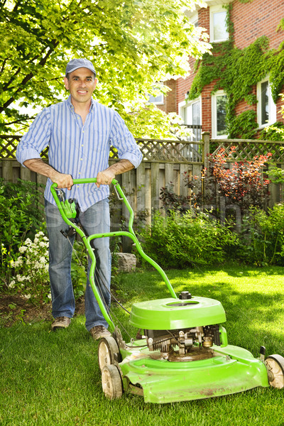 Man mowing lawn Stock photo © elenaphoto