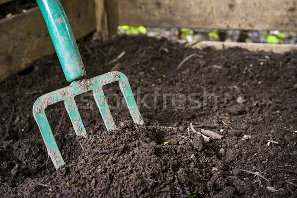 Garden fork turning compost Stock photo © elenaphoto