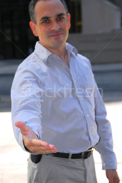 Businessman offering hand Stock photo © elenaphoto