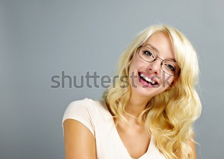 Happy woman wearing glasses Stock photo © elenaphoto