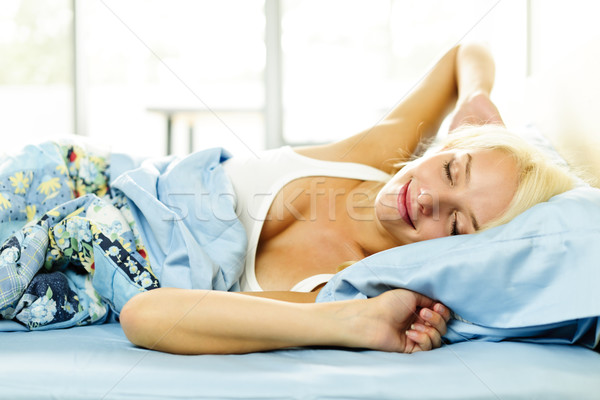 Young woman waking up Stock photo © elenaphoto