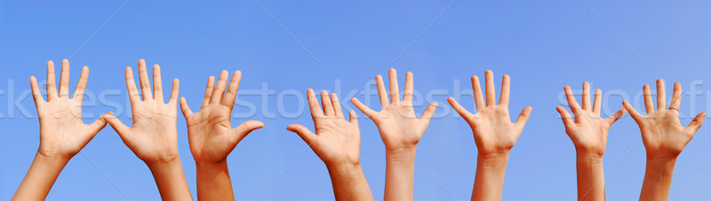 Handen rij Open palmen blauwe hemel hemel Stockfoto © elenaphoto