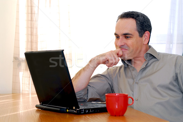 Man with laptop Stock photo © elenaphoto